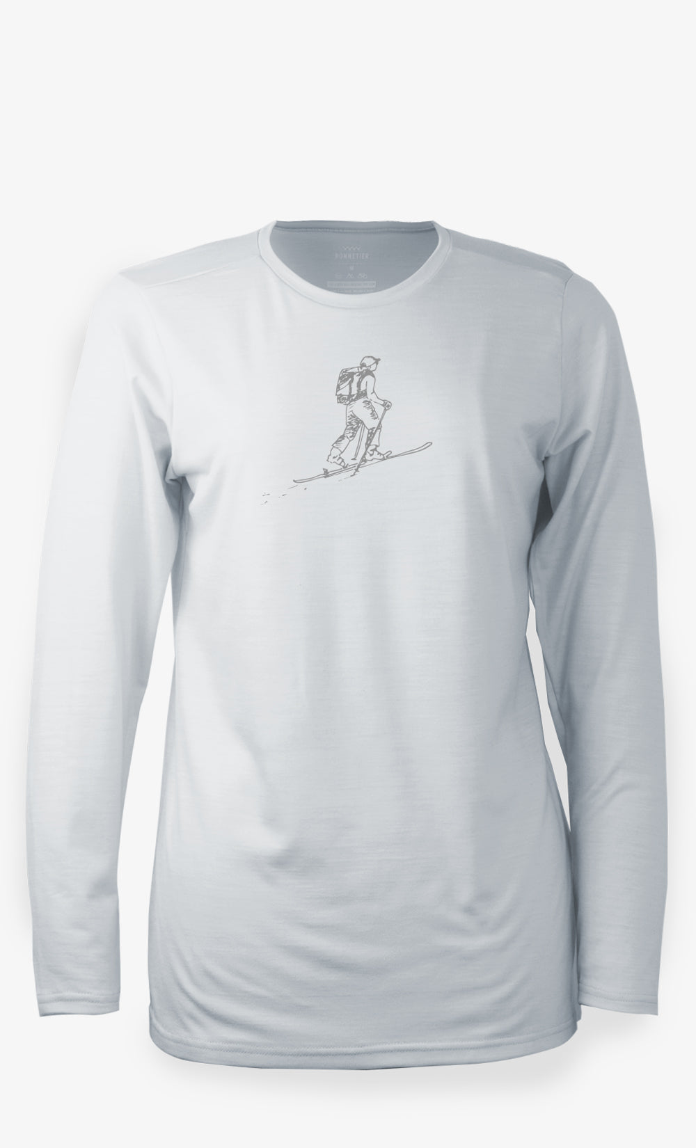 Haut femme gris arctique en laine mérinos BONNETIER avec illustration de skieuse imprimée à l’avant.